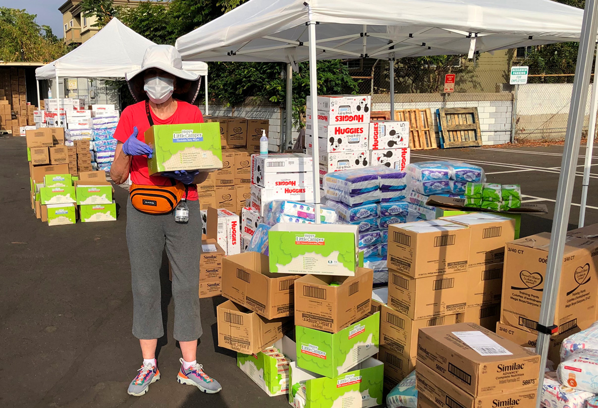 Los Angeles Trustee Stephanie Campbell helped distribute children’s books and essential items at Magnolia Place parking lot.