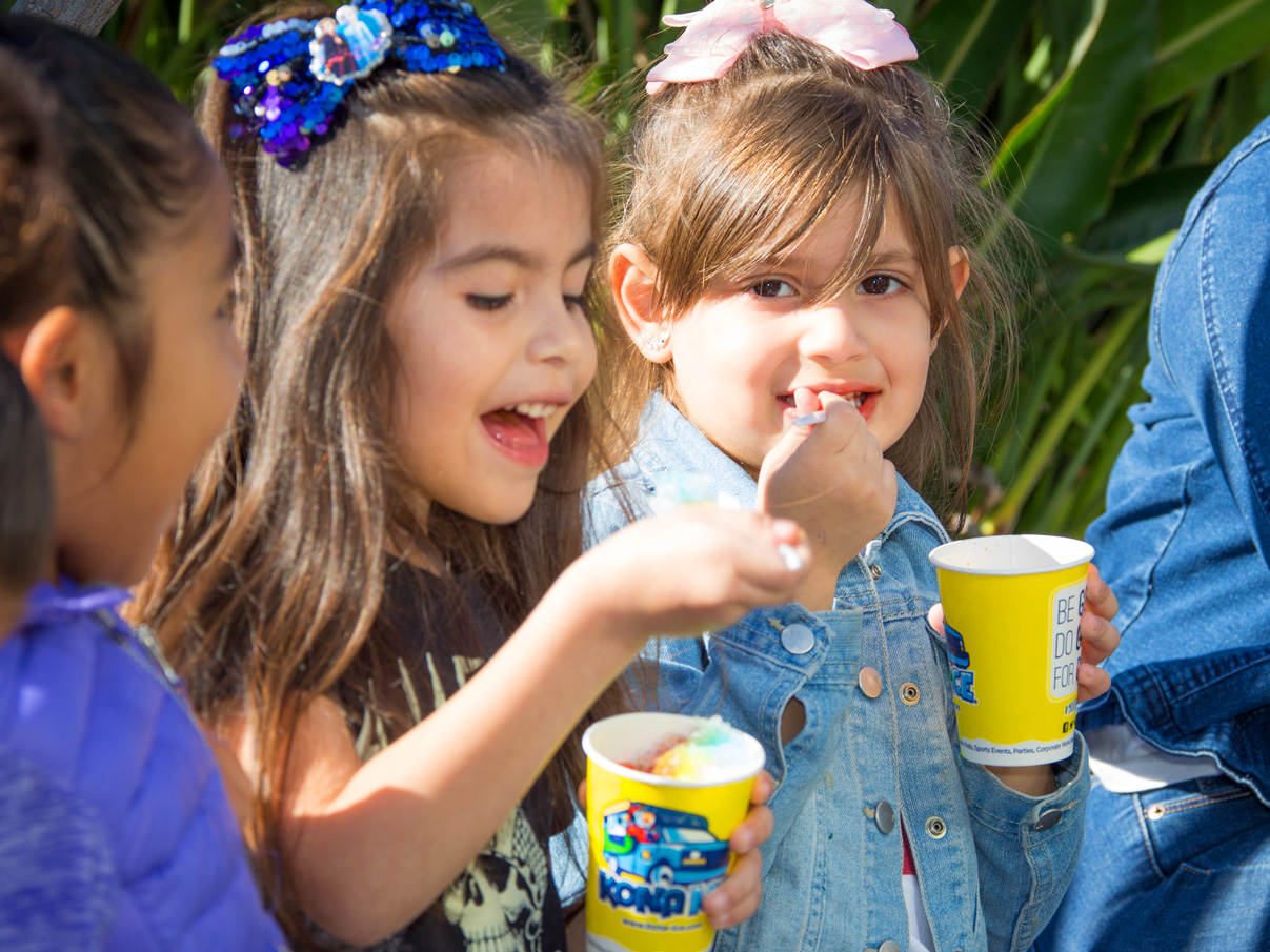 <strong>Children’s Bureau Family Event:</strong> Children enjoying Kona Ice treats